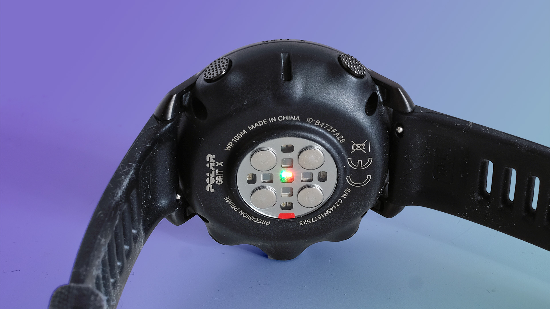 The sensors of the Polar Grit X on a purple background.