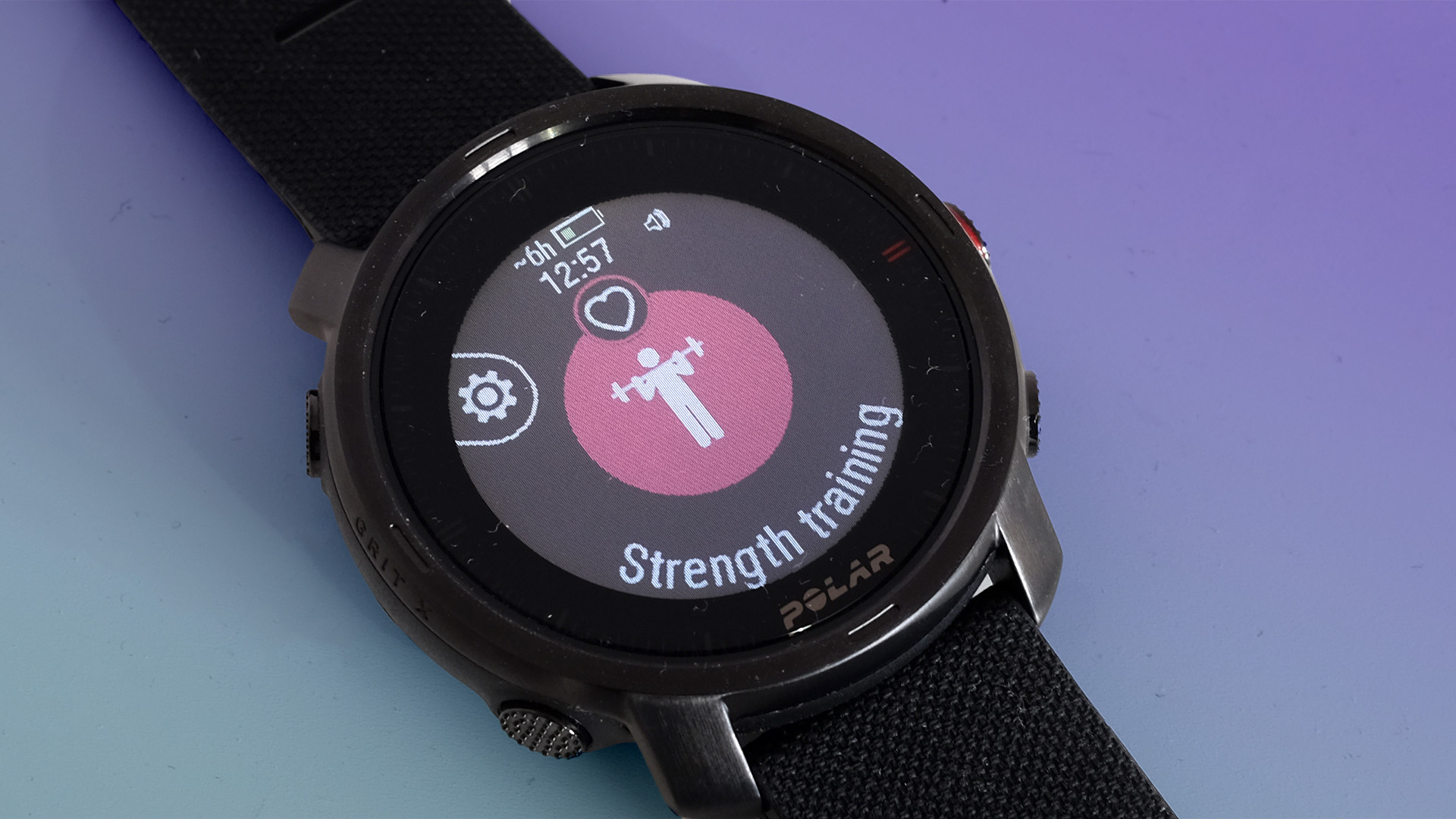 The strength training screen of the Polar Grit X on a purple background.