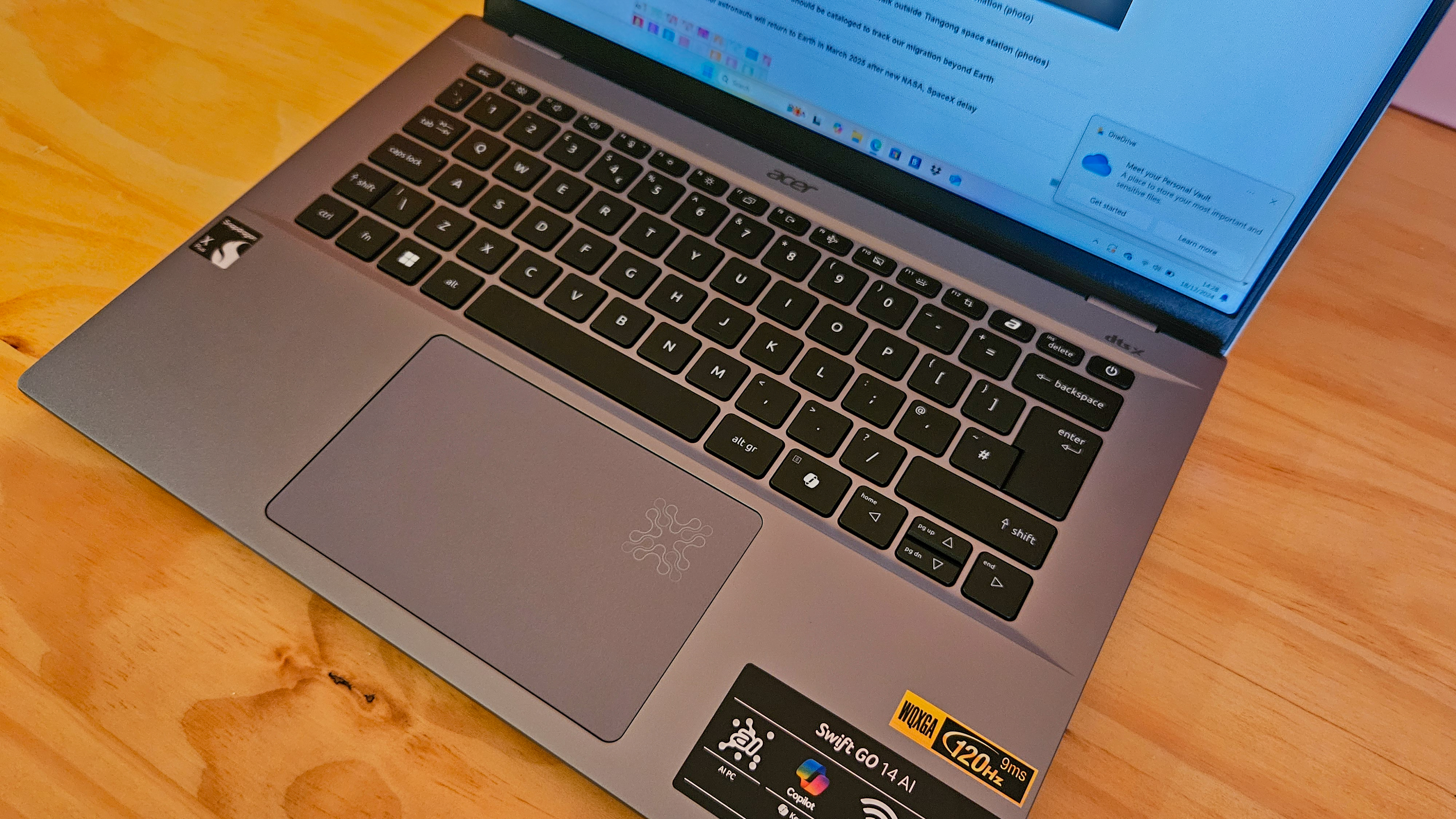 Acer Swift Go 14 - high angle view of mousepad and keys