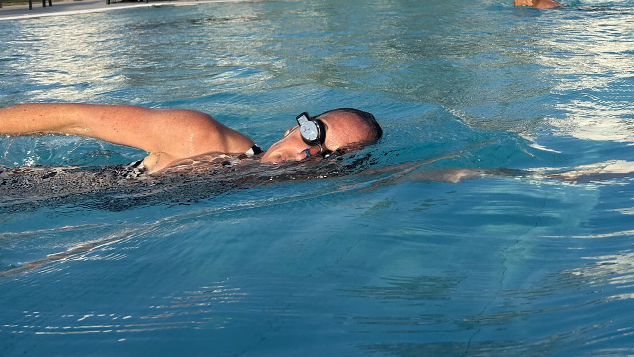 FORM Smart Swim 2 swimming goggles being worn by our reviewer