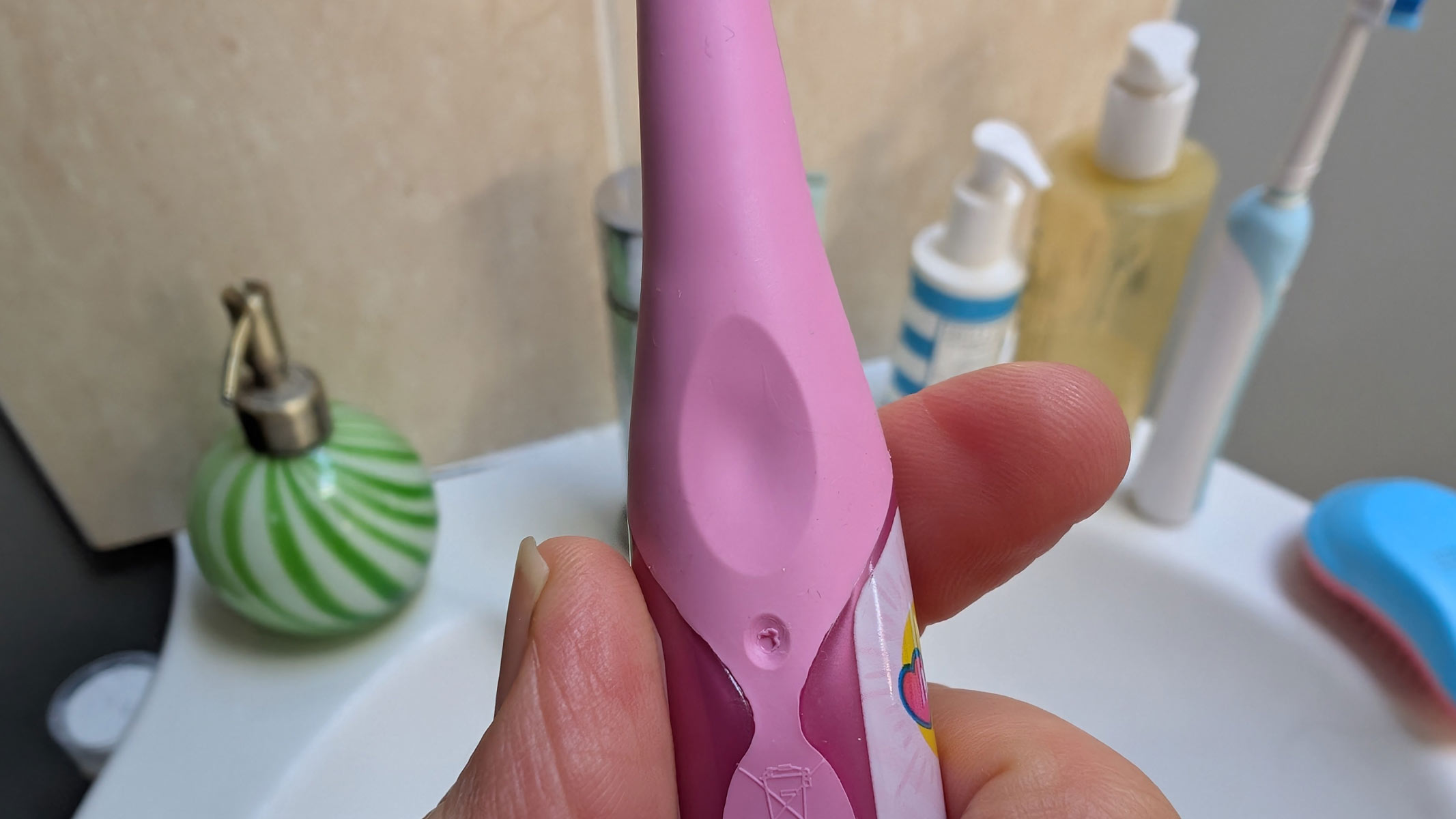 Colgate Kids Battery Powered Toothbrush being tested by our reviewer